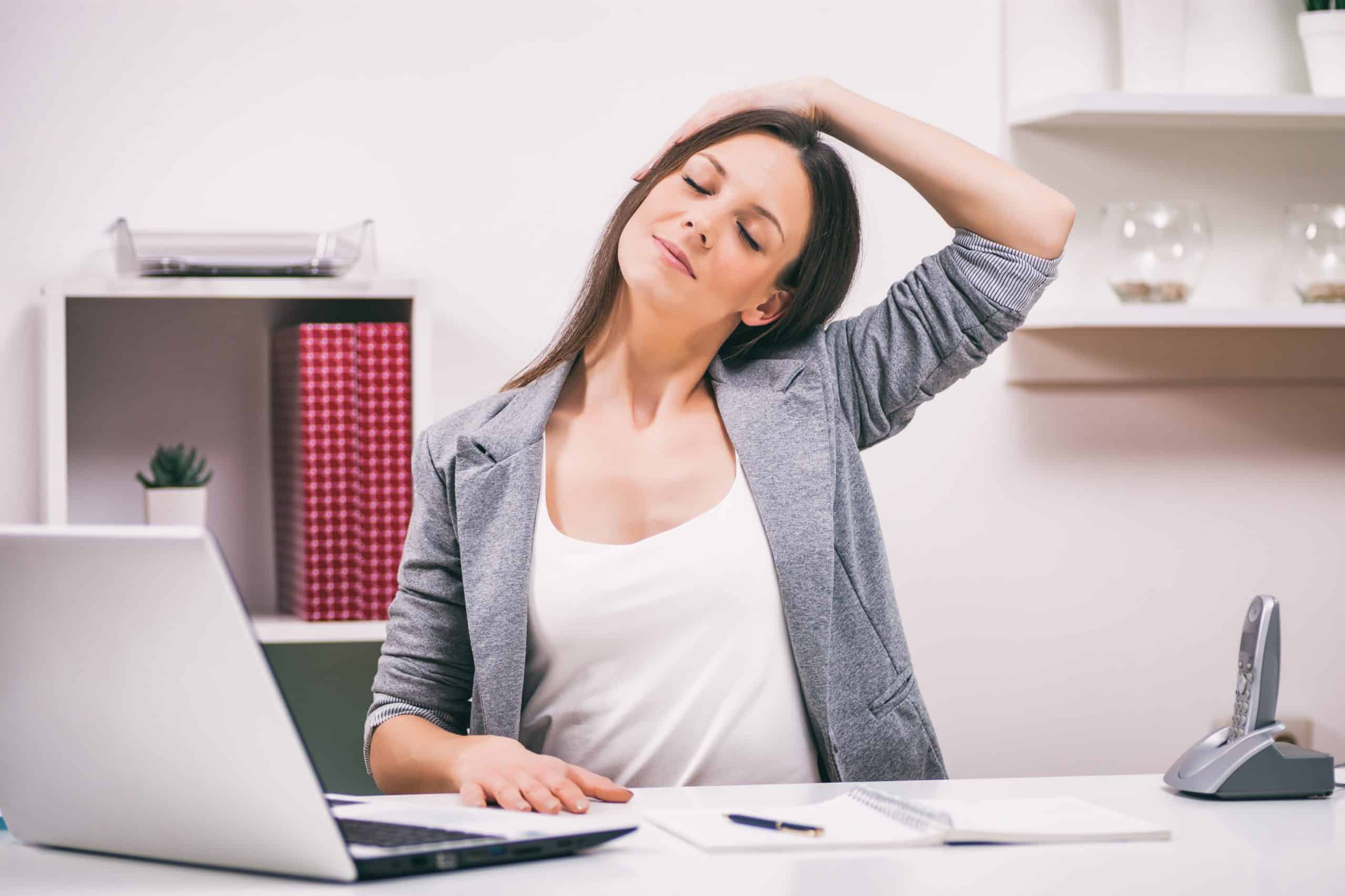 woman stretching at desk