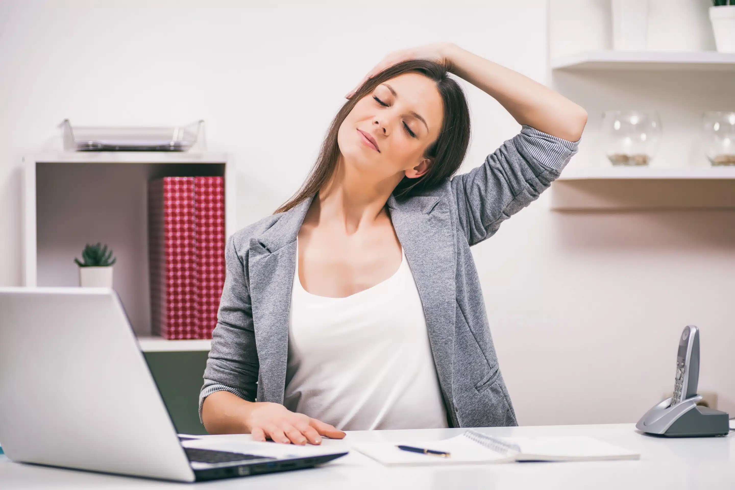 woman office stretching at computer woman stretching at desk