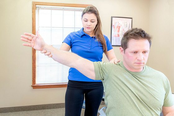 woman stretching at desk