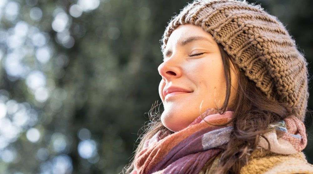 woman breathing outside