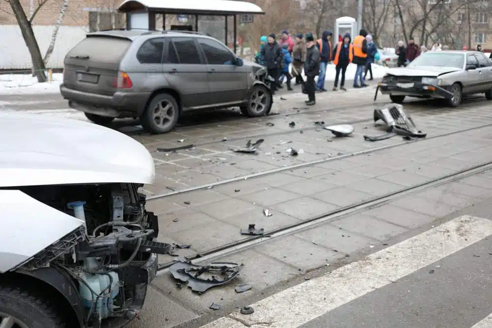 Group,Car,Accident,With,Many,Damages,On,Street,,People,Out car accident city street winter