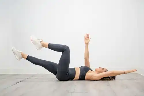 Woman doing dead bug stretch